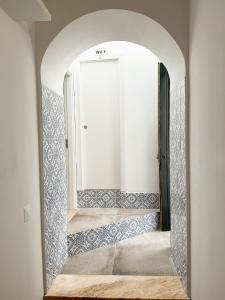 a mirror in a room with a door at Sao Pedro Guest House in Faro +29 photos