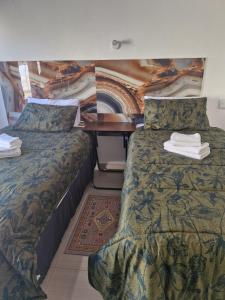 Katil atau katil-katil dalam bilik di Dundee Viks Guest House