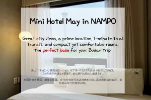 a window with a sign that saysmt hotel may in korea at Mini Hotel May Nampo in Busan