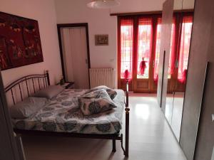 Ένα ή περισσότερα κρεβάτια σε δωμάτιο στο Casa Ikigai - accogliente e spaziosa