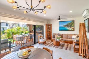 a dining room and living room with a dining table at Vista Natura in Nuevo Vallarta