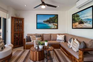 a living room with a couch and a table at Vista Natura in Nuevo Vallarta