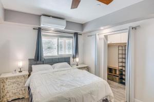 a bedroom with a large bed and a window at The Surf Retreat in Conejo Valley Trailer Park