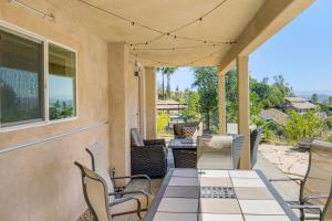 an outdoor patio with chairs and a table at The Surf Retreat in Conejo Valley Trailer Park