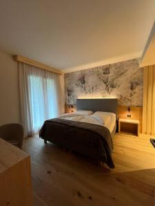 Ένα ή περισσότερα κρεβάτια σε δωμάτιο στο Rauzi apartments