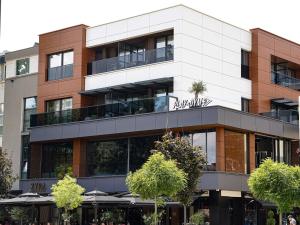 a building with a restaurant in front of it at Zyra boutique hotel in Leskovac