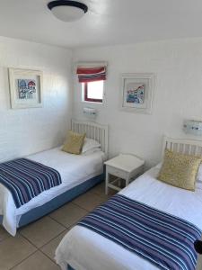 Postel nebo postele na pokoji v ubytování Kaliva 479 @ Club Mykonos Resort + 18 fotografií