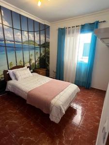 Ένα ή περισσότερα κρεβάτια σε δωμάτιο στο Casa Tajinaste