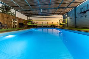 a large blue swimming pool in a house at King Solomon Villa in Wadi Keren