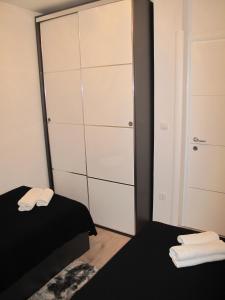Postel nebo postele na pokoji v ubytování Apartments Mia Krk