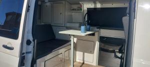 an interior view of an rv with a small kitchen at Autocaravana Camper in Las Palmas de Gran Canaria