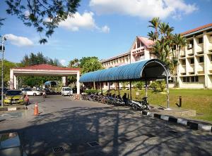 a group of bikes parked in front of a building at HmHome-five in Sibu