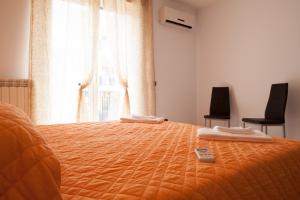 A bed or beds in a room at Dimora del Balì