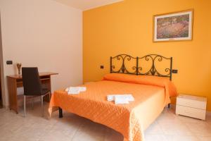 A bed or beds in a room at Dimora del Balì