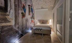 Postel nebo postele na pokoji v ubytování Quintessenza Suite di Vico Carrara
