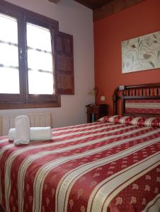 A bed or beds in a room at El manzano Még 4 kép