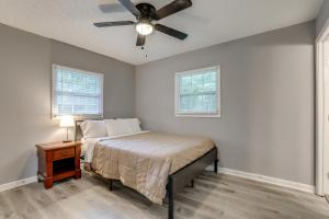 a bedroom with a bed and a ceiling fan at Modern Home with Yard Near ATL Attractions! in Decatur