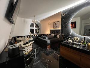 a living room with a couch and a table at Nero Due in Meckenbeuren