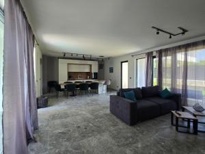 a living room with a couch and a table at Villa Cadaques in Lozenets