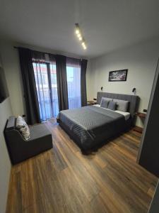 a bedroom with a bed and a couch in it at Villa Cadaques in Lozenets +18 photos