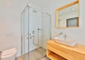 a bathroom with a glass shower and a sink at Villa Serenity in Kas +45 photos