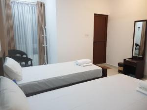 Postel nebo postele na pokoji v ubytování Blackthorn Hotel