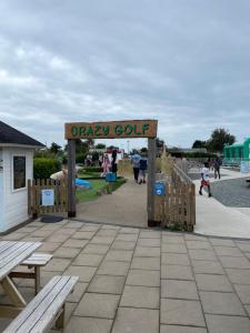 a sign for an orsa cut at a playground at Snowdrop Caravan in Porthmadog