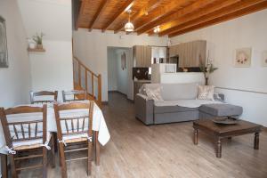 a living room with a couch and a table at Galinos traditional house A in Eresos