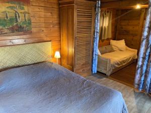Postel nebo postele na pokoji v ubytování Les Bungalows les Vanilliers, Sud Sauvage avec piscine