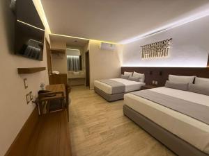 Postel nebo postele na pokoji v ubytování Hotel Makkan Boca