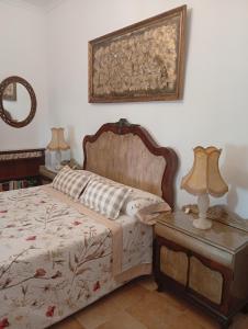 Postel nebo postele na pokoji v ubytování Casa Rural en San Carlos del Valle- Doña Gumersinda