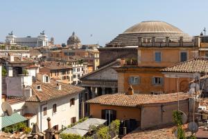 a view of roofs of buildings in a city at Celeste Retreat al Pantheon - Homkeey Apartments in Rome