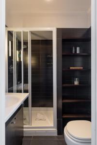 a bathroom with a toilet and a sink at Celeste Retreat al Pantheon - Homkeey Apartments in Rome +14 photos