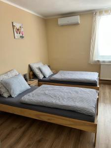 Postel nebo postele na pokoji v ubytování U Vrbů