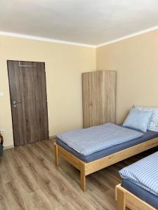 Postel nebo postele na pokoji v ubytování U Vrbů