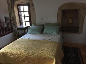 Una cama o camas en una habitación de Casa Aptera