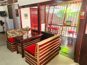 a room with a table and a bench and a window at Villa 6 - Luxury 2 Bed Villa - Small Private Garden in Cocles