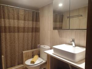 a bathroom with a sink and a toilet and a shower at Kanari Holiday Home in Gourna +19 photos