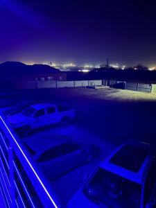 two cars parked in a parking lot at night at Okuhle Guesthouse Steelpoort in Steelpoort
