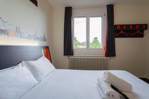 Katil atau katil-katil dalam bilik di easyHotel Zürich City West