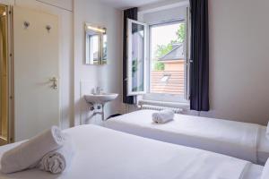 Katil atau katil-katil dalam bilik di easyHotel Zürich City West