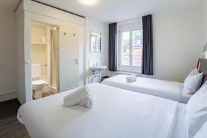 Katil atau katil-katil dalam bilik di easyHotel Zürich City West