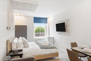 Ένα ή περισσότερα κρεβάτια σε δωμάτιο στο Luxury 2 Bed Studio By Hms Warrior & Mary Rose