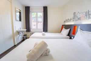Katil atau katil-katil dalam bilik di easyHotel Zürich City West
