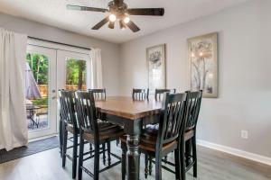 a dining room with a wooden table and chairs at Perdido Key Beach Pad in Pensacola