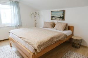 a bedroom with a large bed in a room at Penzión Hubert in Zuberec +33 photos