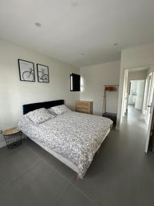 a bedroom with a bed and a television in it at Villa familiale & plongeons in Sainte-Eulalie +23 photos