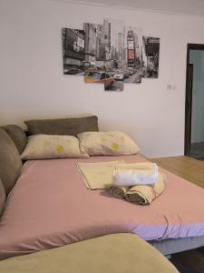 a bed with two towels on top of it at Apartments Opsenica Barbat in Barbat na Rabu +47 photos