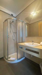 a bathroom with a shower and a sink at Luxury Rooms Padova Station in Padova