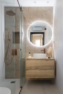 a bathroom with a sink and a mirror at Villa Beach Barcelona in Montgat